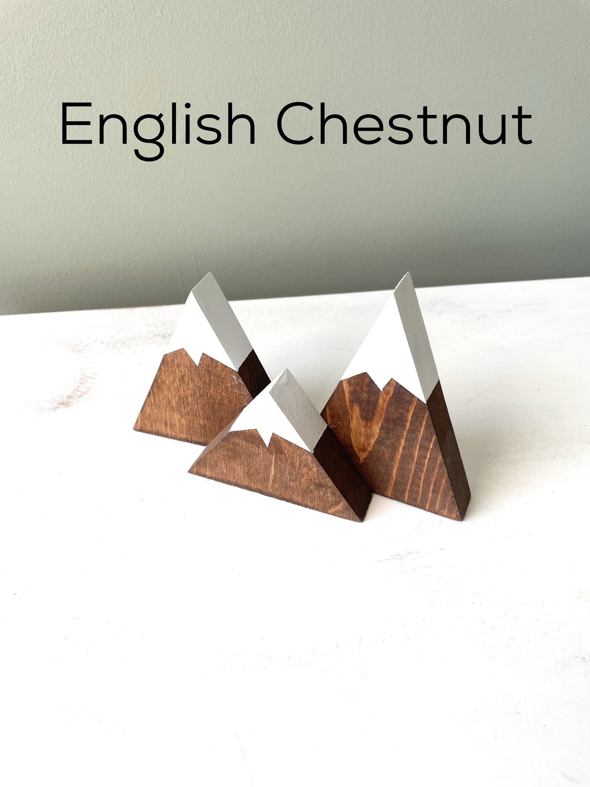 Close-up of the mountain decor with meticulously painted snow caps english chestnut stain